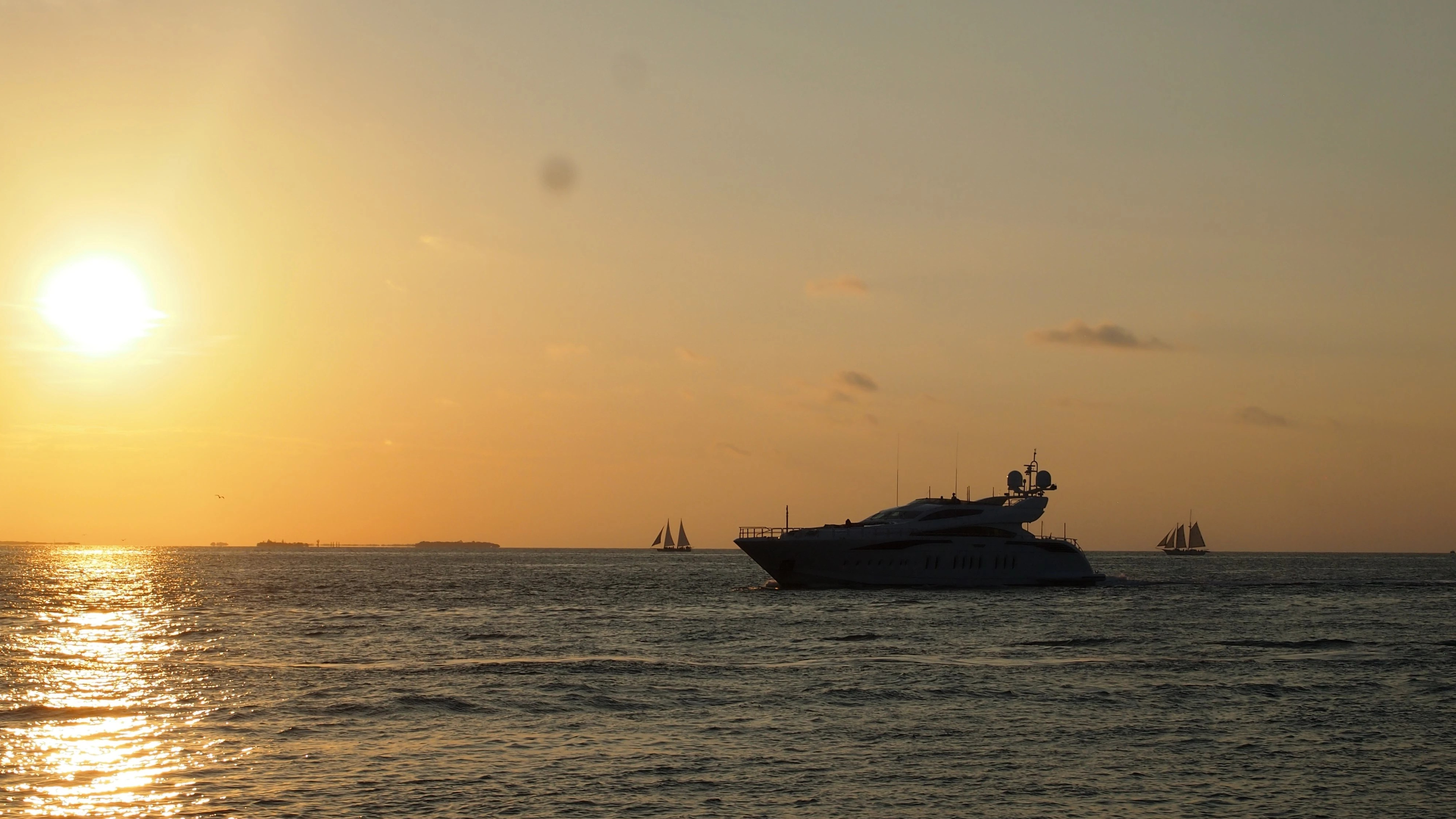 a yacht with the sunset in beautiful keywest florida in the background. Polyester jacht